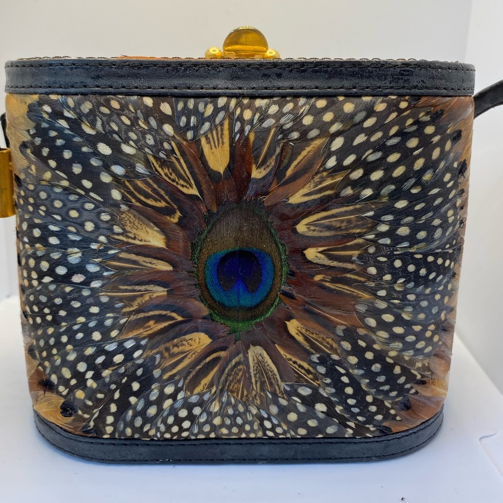 Designer handbag with feather